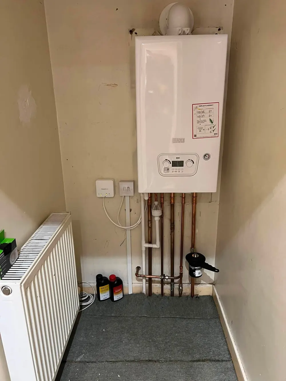 New Baxi boiler fitted in the same cupboard with neat pipework