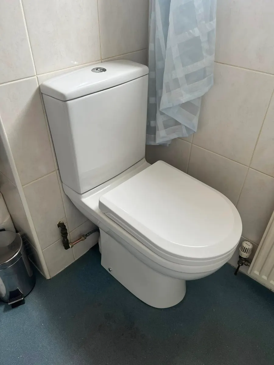 New close-coupled toilet fitted in a bathroom