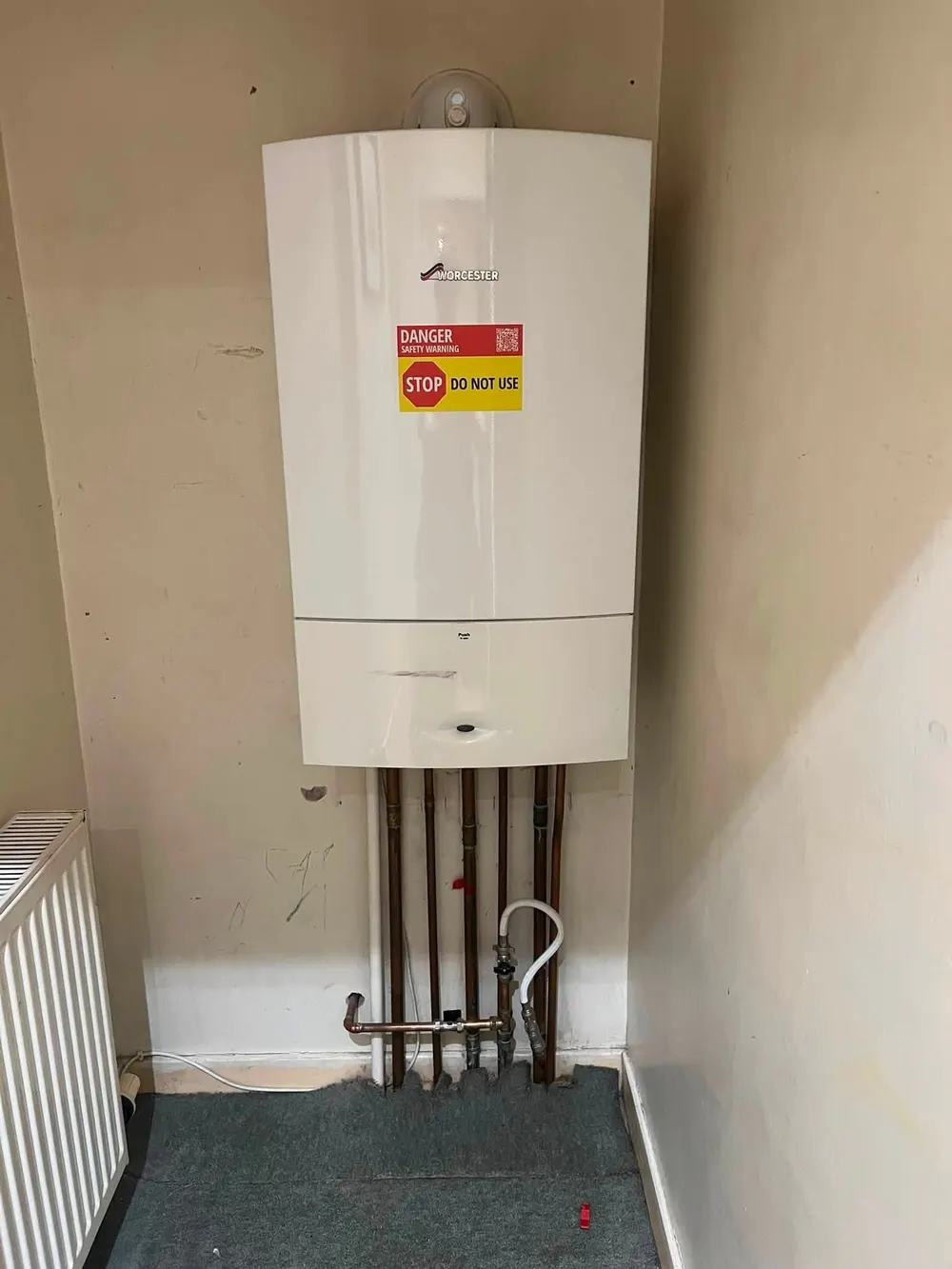 Old Worcester boiler with a red danger do not use label