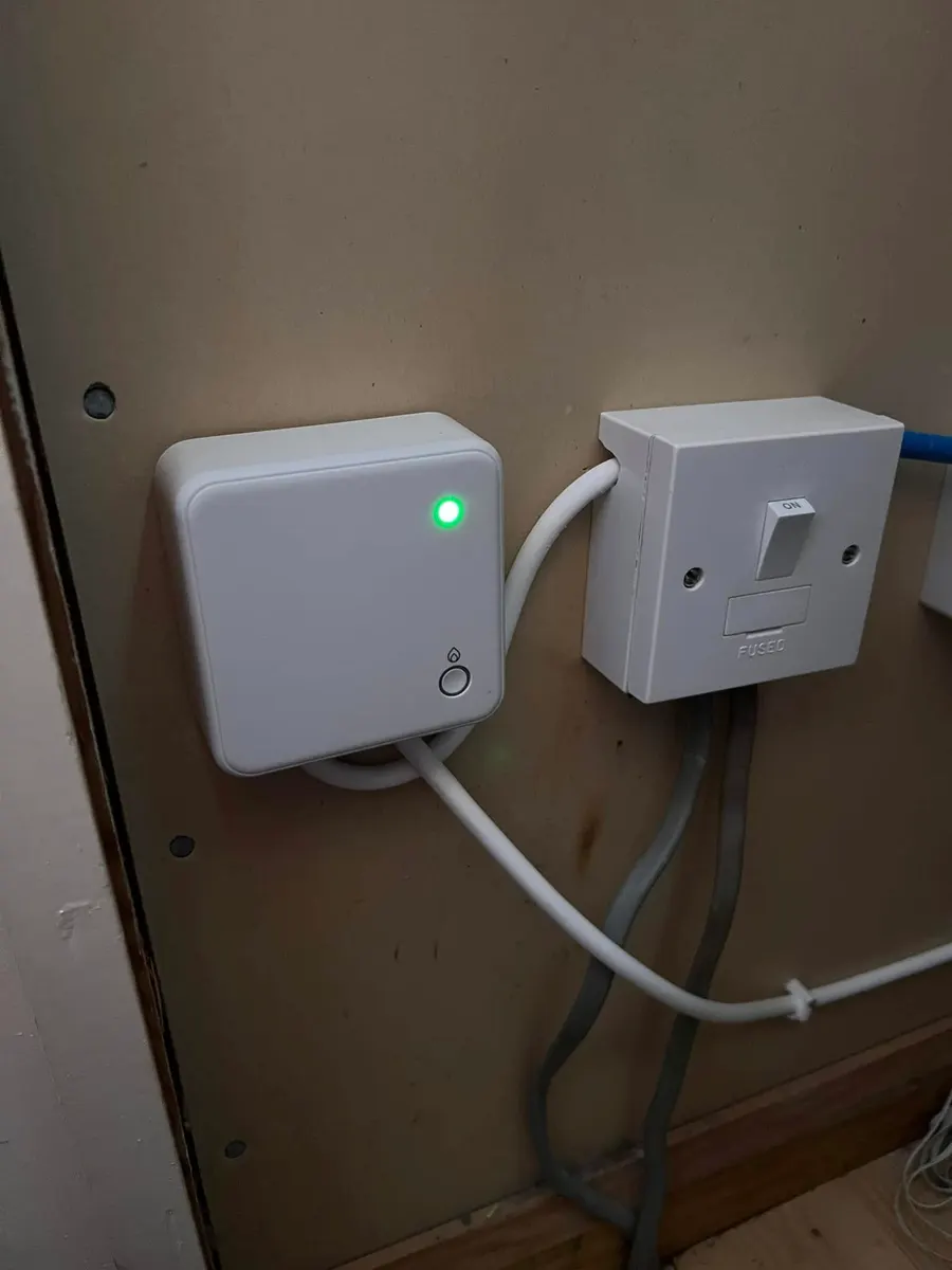 New wireless heating control receiver fitted on a wall