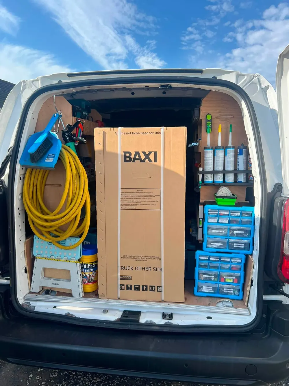 Van loaded with a new Baxi boiler, hoses and fittings